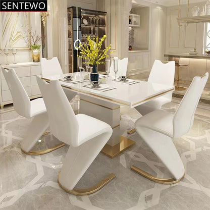 SENTEWO Table à manger de luxe moderne avec 8 chaises de salle à manger, base en acier inoxydable doré, plateau en verre trempé, chaise de dîner sirène